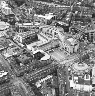 Oblique aerial view centred on the hotel, offices and conference centre, taken from the ESE.