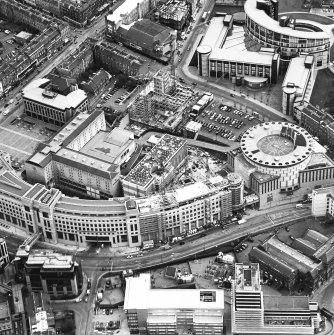 Oblique aerial view centred on the hotel, offices and conference centre with Scottish Widows offices adjacent, taken from the NW.