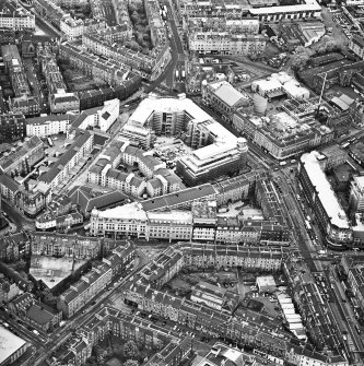 Oblique aerial view centred on Princes Exchange with hall adjacent, taken from the N.