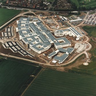 Oblique aerial view centred on the hospital, taken from the NE.