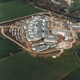 Oblique aerial view centred on the hospital, taken from the NNE.