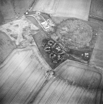 Oblique aerial view centred on the remains of an anti-aircraft battery, taken from the E.
