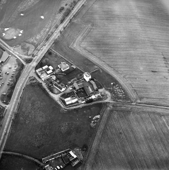 Oblique aerial view centred on the tower-house, taken from the ESE.