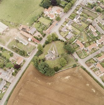 Oblique aerial photograph of East Saltoun centred on theParish Church and Graveyard, taken from the WNW.