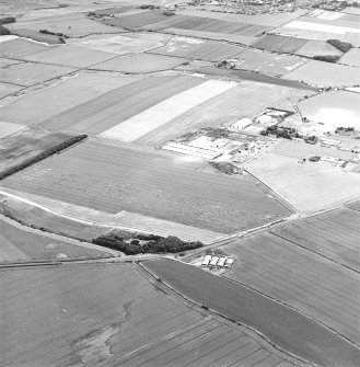 Oblique aerial view of Drem Airfield centred on the remains of the airfield, taken from the SE.