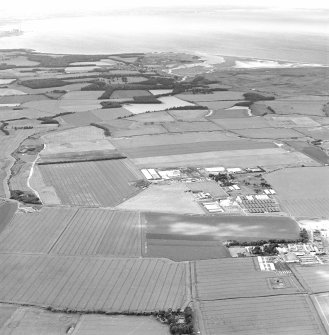 Oblique aerial view of Drem Airfield centred on the remains of the airfield, taken from the E.