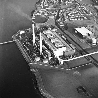 Oblique aerial view of the Cockenzie Generating Station centred on the power station with the  harbour adjacent, taken from the W.