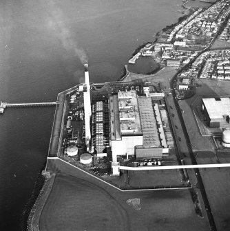 Oblique aerial view of the Cockenzie Generating Station centred on the power station with harbours adjacent, taken from the SE.