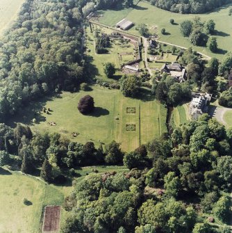 Aerial view of Coulston House, gardens, stables and dovecot, taken from the SE.