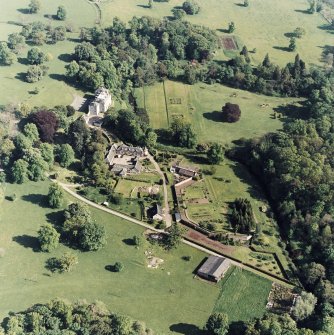 Aerial view of Coulston House, gardens, stables and dovecot, taken from the NW.