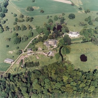 Aerial view of Coulston House, gardens, stables and dovecot, taken from the SSW.