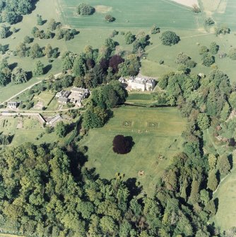 Aerial view of Coulston House, gardens, stables and dovecot, taken from the SW.