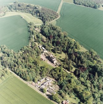 Oblique aerial view of Biel House, garden, gardener's cottage, bridge, dovecot, cottages and coach-houses, taken from the NW.
