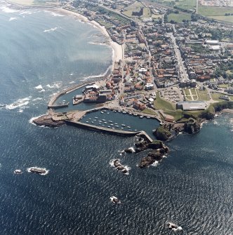 Oblique aerial view centred on the harbour with the remains of the battery adjacent, taken from the NNW.