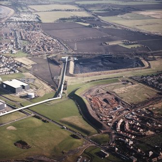 Oblique aerial view centred on the coal store with town adjacent, taken from the W.