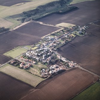 General oblique aerial view centred on the village, taken from the NE.