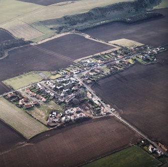 General oblique aerial view centred on the village, taken from the NE.