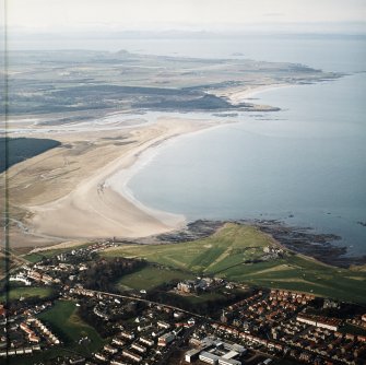 General oblique aerial view looking across the school, club house and Belhaven Bay towards North Berwick Law, the Firth of Forth and the Bass Rock, taken from the ESE.