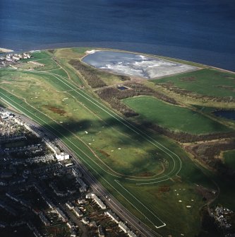 Oblique aerial view centred on the race course and ash lagoons, taken from the SE.