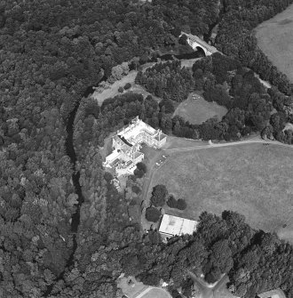 Oblique aerial view centred on the country house and garden with bridge adjacent, taken from the SSE.