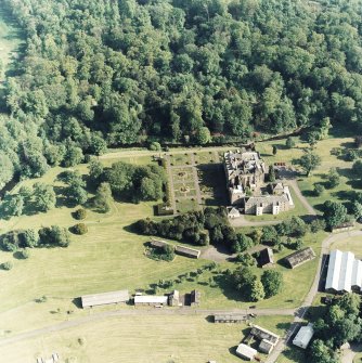 Oblique aerial view of Newbattle Abbey, garden, sundials and military camp, taken from the NNW.