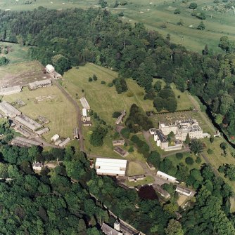 Oblique aerial view of Newbattle Abbey, garden, sundials and military camp, taken from the WSW.