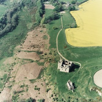 Oblique aerial view of Crichton Castle and Crichton church, taken from the SSW.