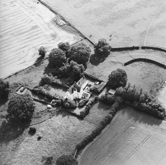 Oblique aerial view centred on the country house with garden adjacent, taken from the NE.