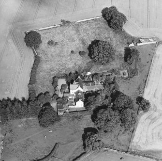 Oblique aerial view centred on the country house with garden adjacent, taken from the WSW.