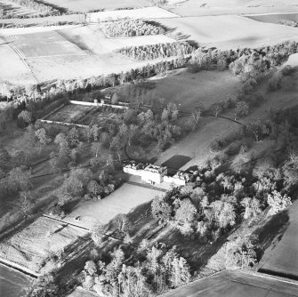 Preston Hall, oblique aerial view, taken from the SE, centred on the country house with the formal garden in the centre left of the photograph.