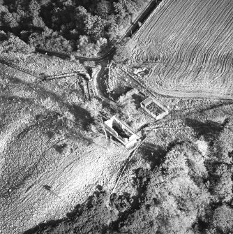 Oblique aerial view of Penicuik, Castle Brae, Uttershill Castle centred on the remains of a tower-house, taken from the W.
