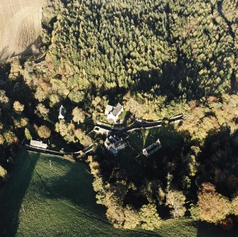 Oblique aerial view of the Temple Parish Church centred on the church with other church, possible building, culvert and other building adjacent, taken from the SW.