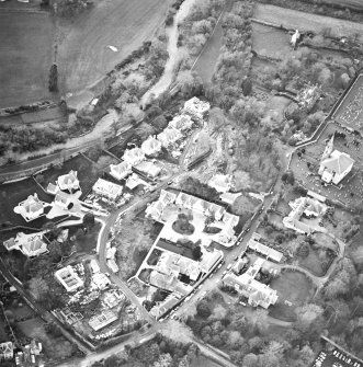 Oblique aerial view centred on Inveresk Gate, church and burial-ground, taken from the NE.