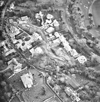 Oblique aerial view centred on Inveresk Gate, church and burial-ground, taken from the WNW.