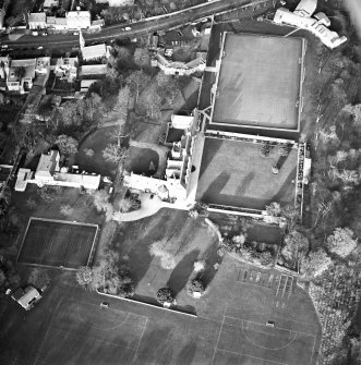 Oblique aerial view centred on the tower-house, school and garden, taken from the SSE.