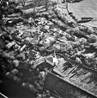 Oblique aerial view centred on Inveresk Gate, church and burial-ground, taken from the NW.