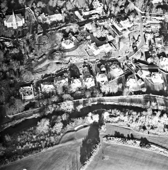 Oblique aerial view centred on Inveresk Gate, church and burial-ground, taken from the SSW.