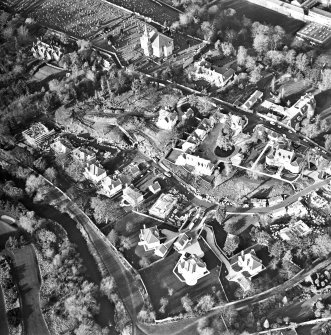 Oblique aerial view centred on Inveresk Gate, church and burial-ground, taken from the SE.