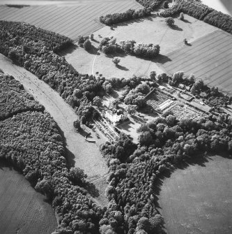 Winston House, oblique aerial view, taken from the SE, centred on the country house and garden.