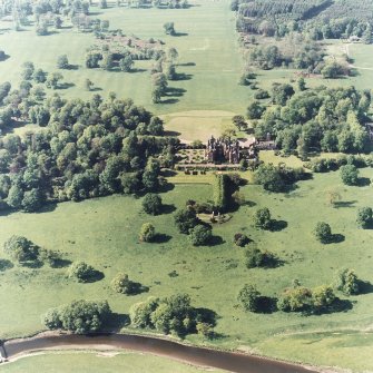 Aerial view of Tyninghame House, the site of Tyninghame manse, St Baldred's Church, the sundial and gardens, and the clock tower court, taken from the SSE.