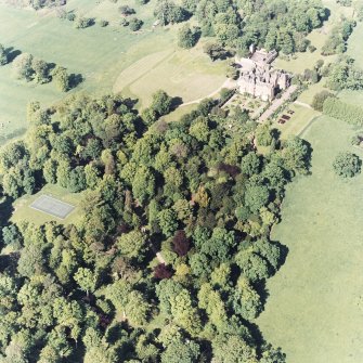 Aerial view of Tyninghame House, the site of Tyninghame manse, the sundial and gardens, and the clock tower court, taken from the SW.