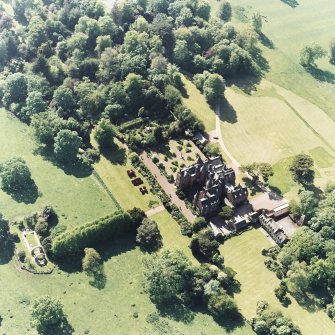Aerial view of Tyninghame House, the site of Tyninghame manse, St Baldred's church, the sundial and gardens and the clock tower court, taken from the SE.