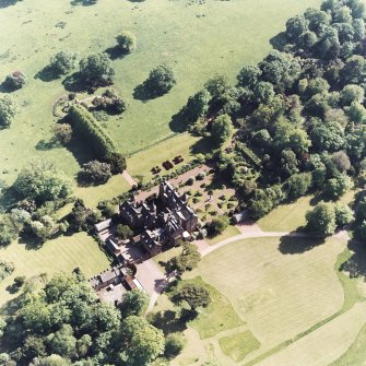 Aerial view of Tyninghame House, the site of Tyninghame manse, St Baldred's church, the sundial and gardens and the clock tower court, taken from the NE.