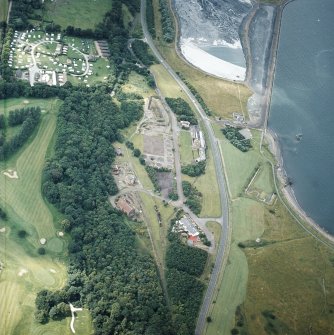 Oblique aerial view centred on the museum and the remains of the coal mine, brick and tileworks and harbour, taken from the ENE.