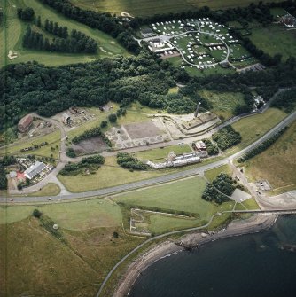Oblique aerial view centred on the museum and the remains of the coal mine, brick and tileworks and harbour, taken from the N.