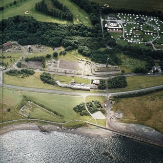Oblique aerial view centred on the museum and the remains of the coal mine, brick and tileworks and harbour, taken from the NNW.