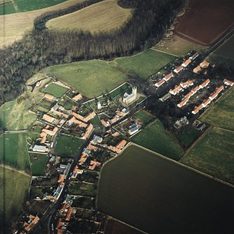 Oblique aerial view of Stenton centred on the church, burial-ground, old church and mausoleum, taken from the S.