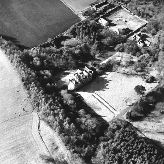 Oblique aerial view, taken from the ESE, centred on the country house.