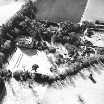 Oblique aerial view taken from the NE, centred on the country house. A dovecot is visible in the bottom right-hand corner of the photograph.
