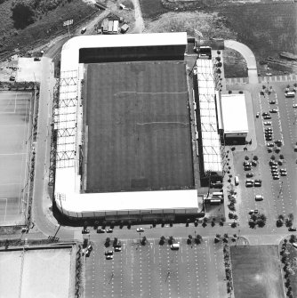 Oblique aerial view centred on the football stadium, taken from the N.